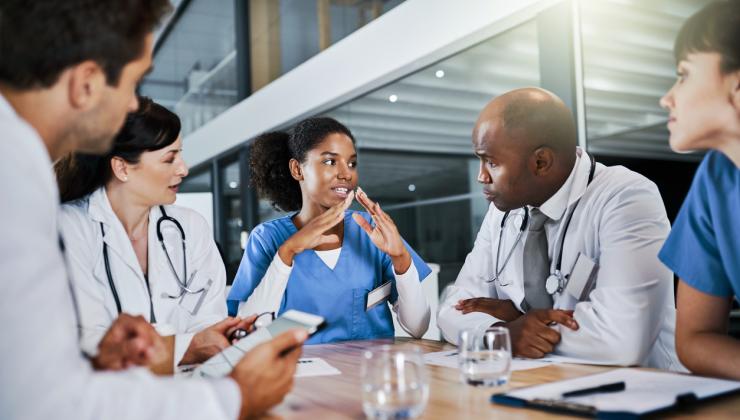 istock-health-care-workers-around-the-table